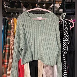 Cropped cable knit sweater